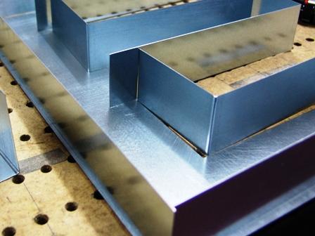 Galvanized steel channel letter returns and formed metal signage components